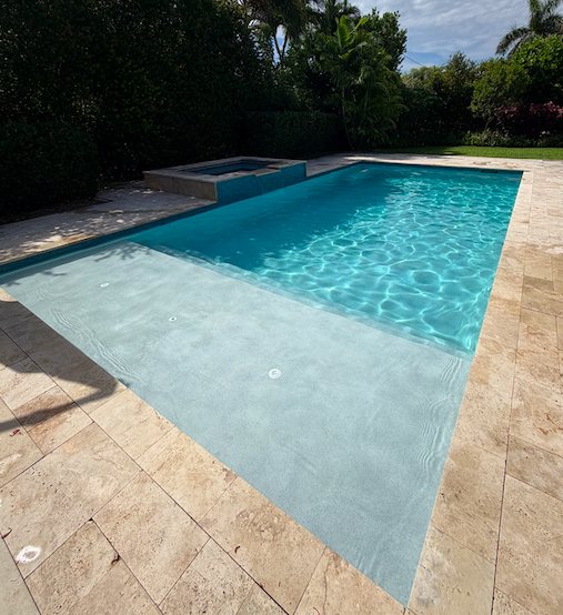 Crystal clear pool and spa maintained by TruBlue Pools of Palm Beach
